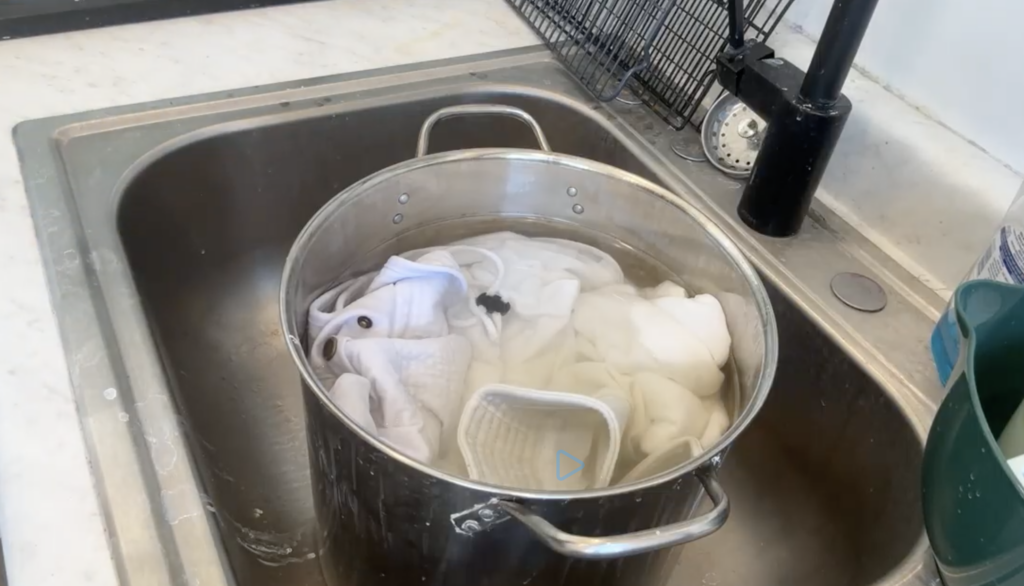 Soaking fabric in soda ash before tie dyeing for brighter, long-lasting colors